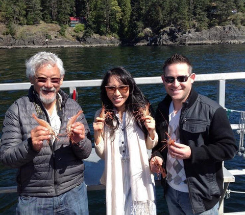 David Suzuki, Mijune Pak and Jason Bangerter, celebrity environmentalist, food blogger and chef, holding some wild caught B.C. spot prawns.