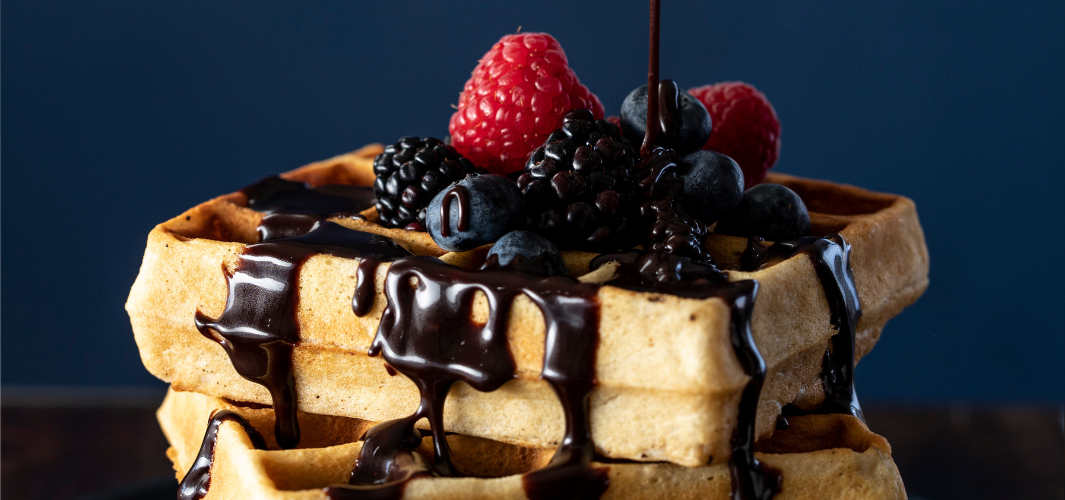 Waffle topped with Sunday Night Foods Premium Chocolate Sauce and Berries