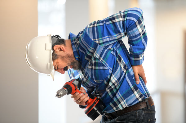 Construction worker experiencing back pain