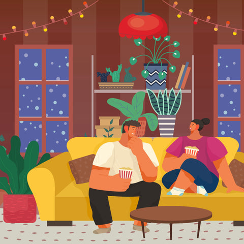 Two people in plant-filled living room