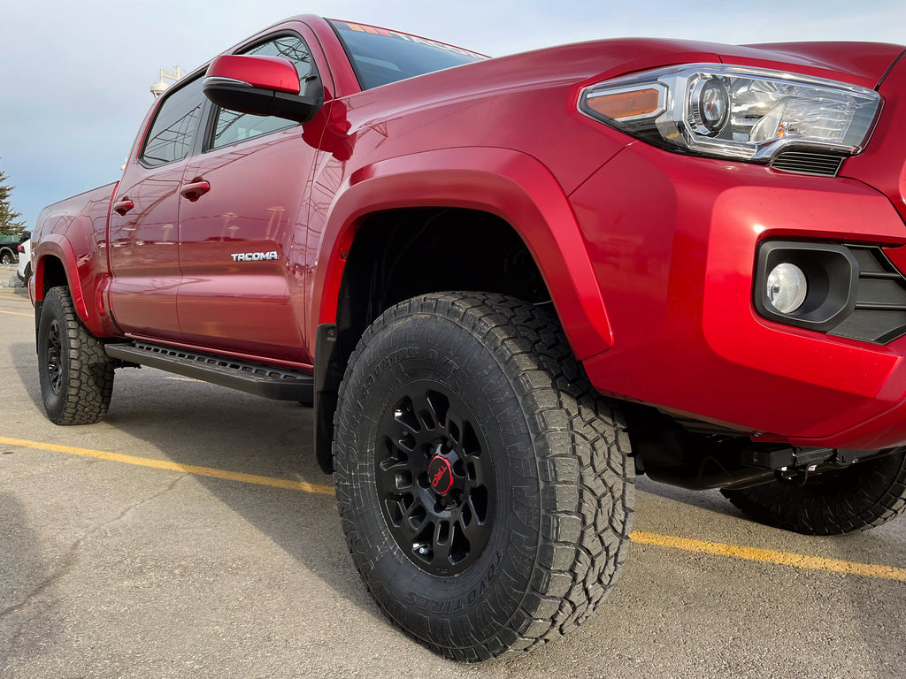 2022 Toyota Tacoma Close Up Of TRD wheels, lift kit, Toyota running boards