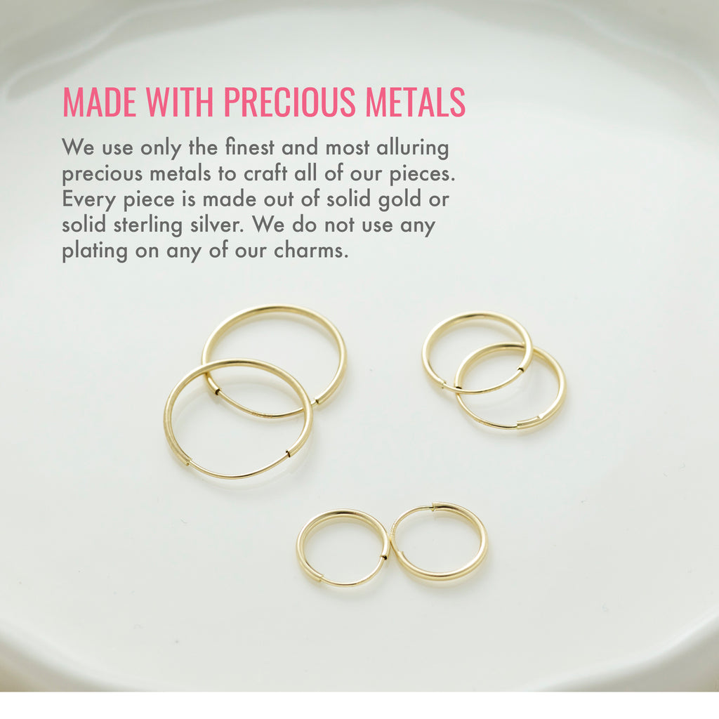 Made with precious metals. We use only the finest and most alluring precious metals to craft all of our pieces. Every piece is made out of solid gold or solid sterling silver. We do not use any plating on any of our charms.