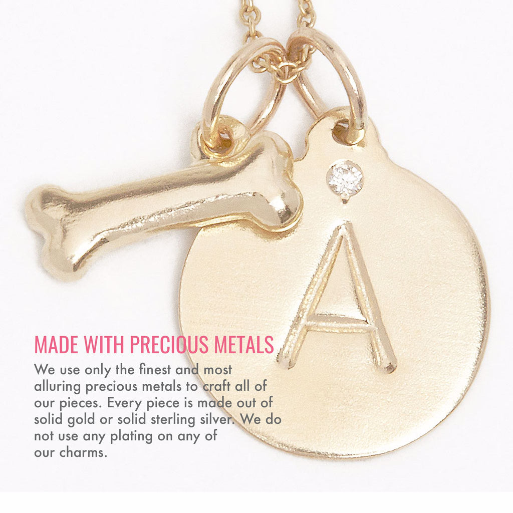 Made with precious metals. We use only the finest and most alluring precious metals to craft all of our pieces. Every piece is made out of solid gold or solid sterling silver. We do not use any plating on any of our charms.