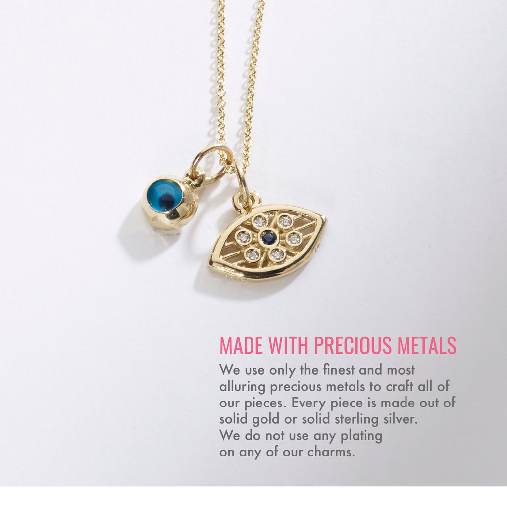 Made with precious metals. We use only the finest and most alluring precious metals to craft all of our pieces. Every piece is made out of solid gold or solid sterling silver. We do not use any plating on any of our charms.