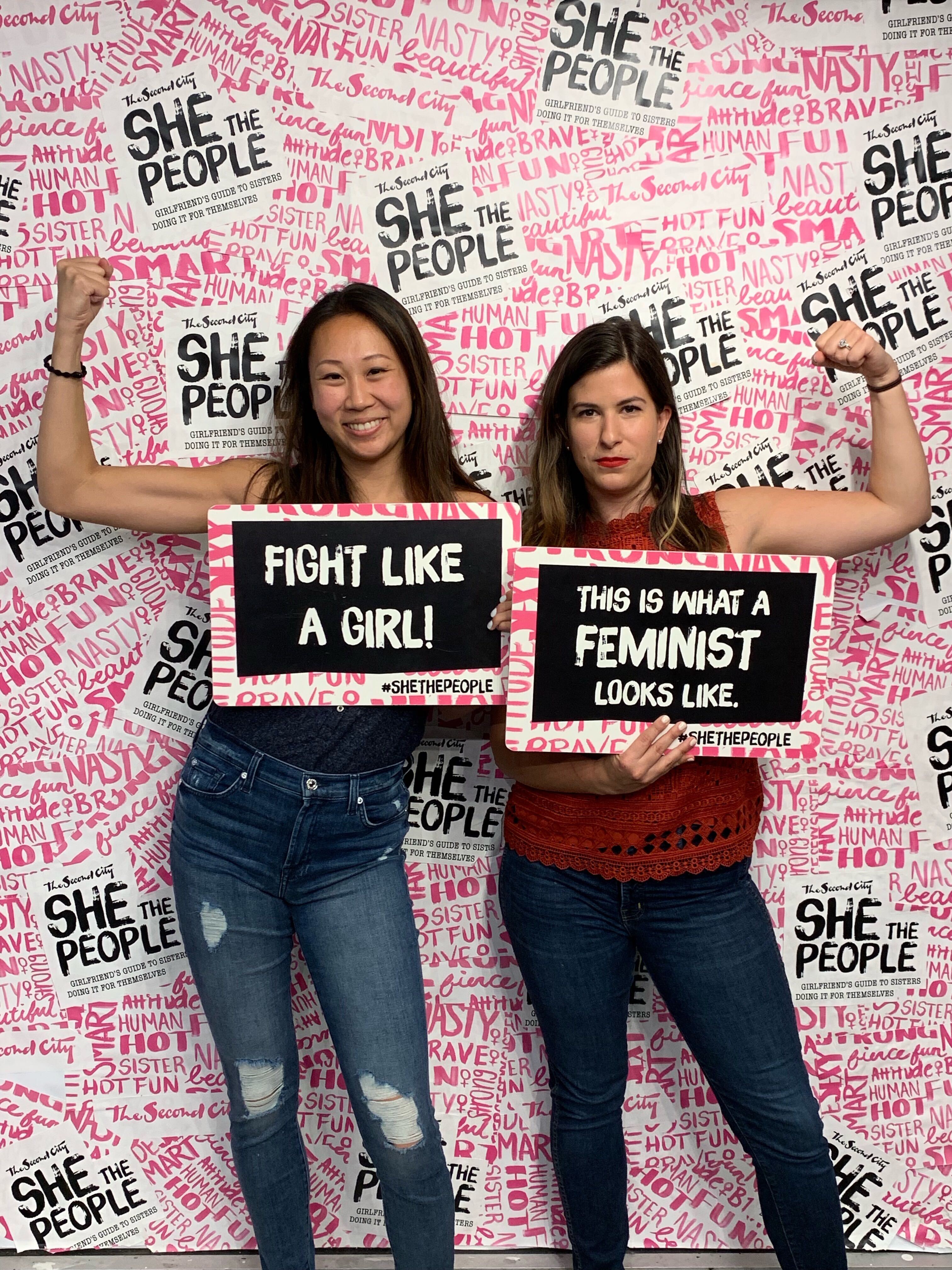 Jane and Heather, Frankly co-founders, holding up feminist signs