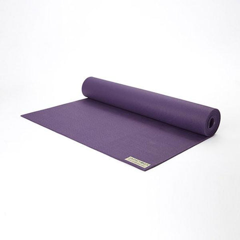 purple yoga mat partially unrolled