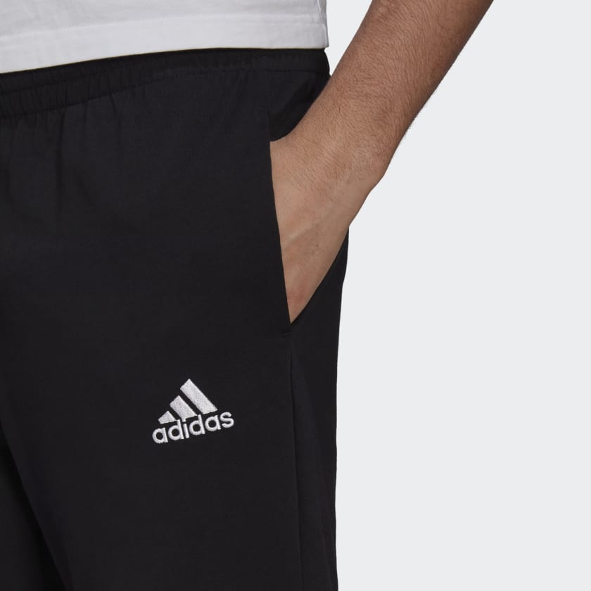 adidas ESSENTIALS TAPERED Pants | Black | Men's stripe