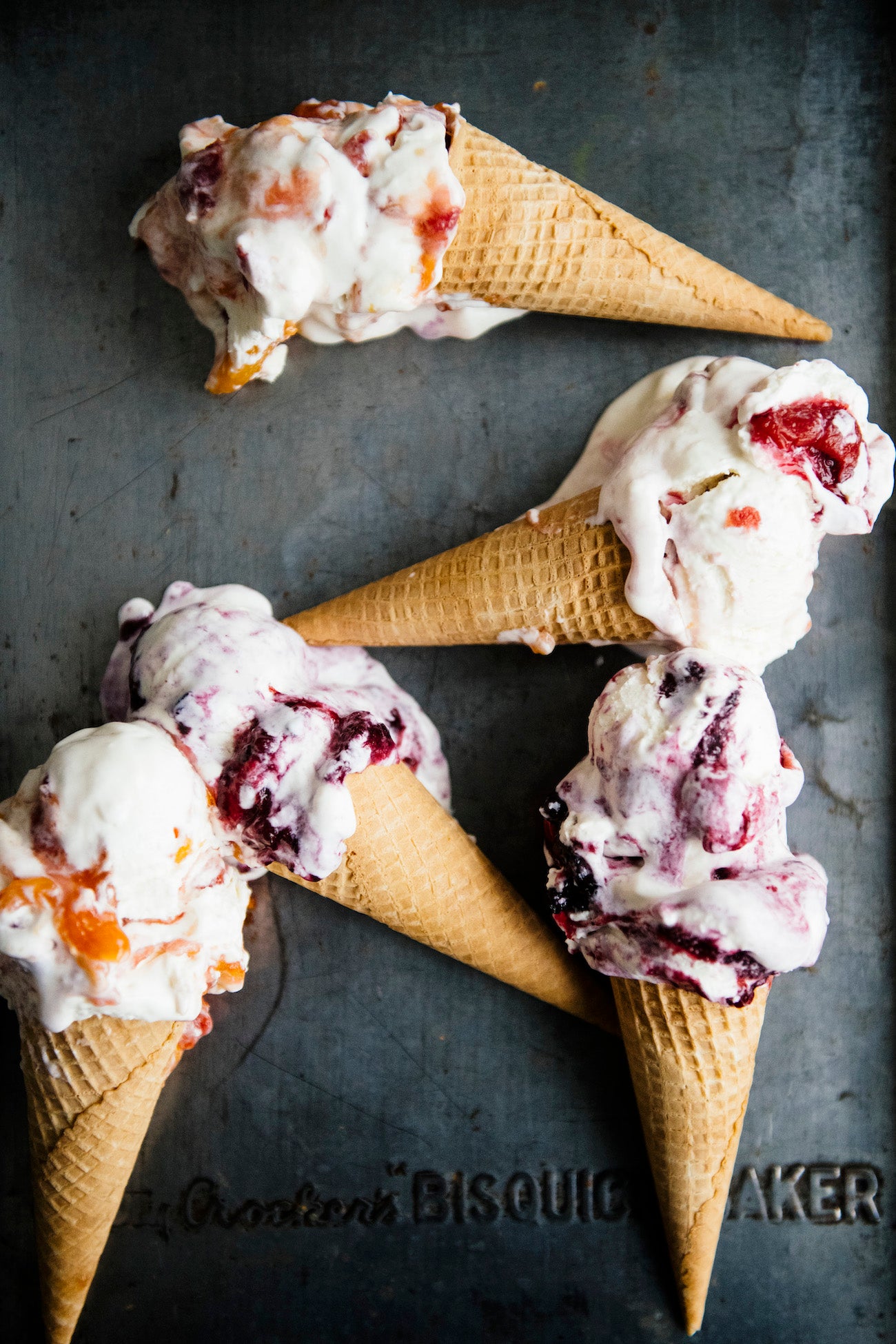 Homemade ice cream swirled with berries, cherries, and peaches.