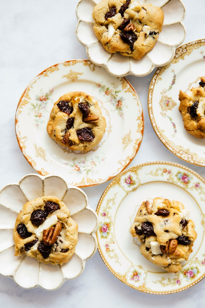 antique plates holding cherry cookies 