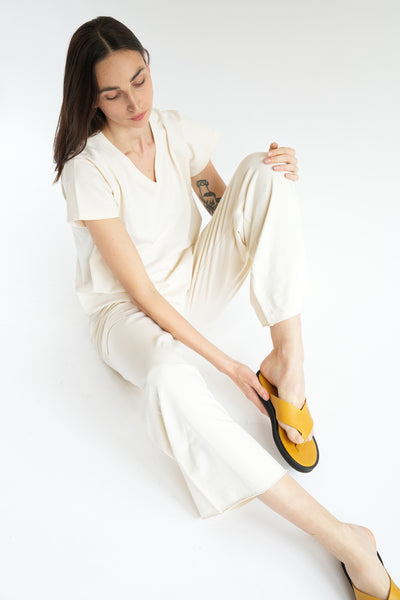 Mustard leather thong sandal and crème cotton knits