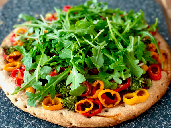 Pizza with fresh arugula