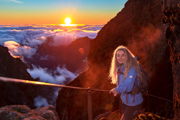 Sunset in the mountains smiling girl