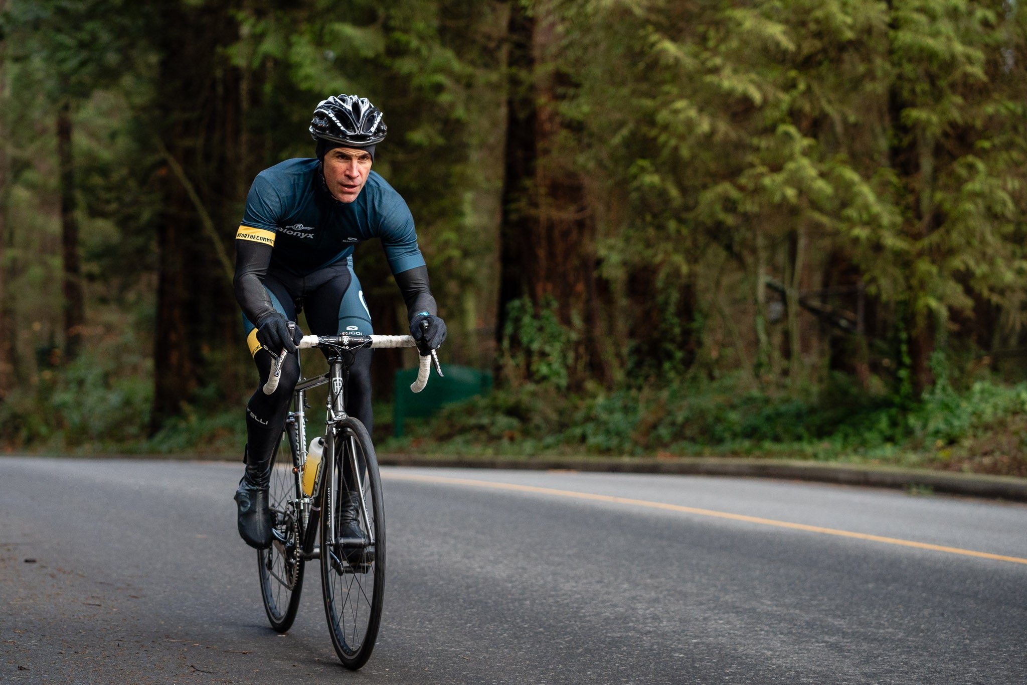 Cyclist riding through Stanley Park in Vancouver