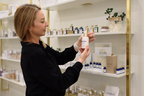woman looking at skincare products