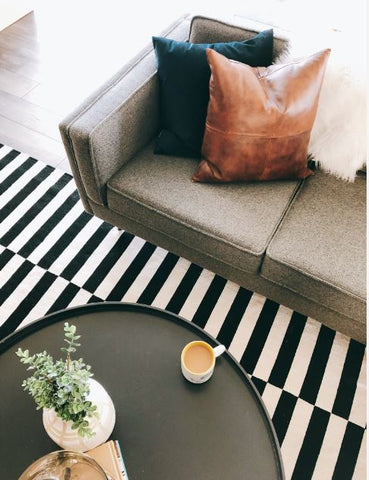 close up on sofa table and rug