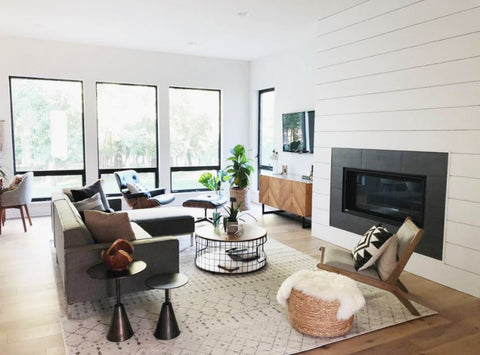 living room with sofa table chair and fireplace