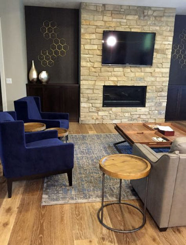 living room with blue chairs and fireplace