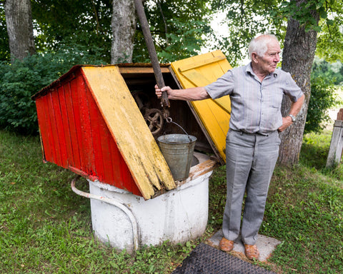 Julius Simonaitis and his water well