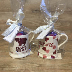 Photo of Emma Bridgewater Mama Bear and Mummy half pint mugs filled with belgian chocolates.
