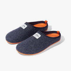 Photo of mercredy blue and orange slippers. They are a mule style with dark blue uppers. The insoles and soles are bright orange.