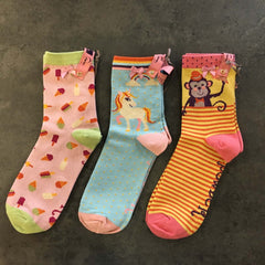 Trio of ankle socks by Powder designs. One has lots of ice creams all over it. Another is a single unicorn image and the third a monkey wearing a hat.