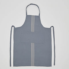 Product photo of the Weaver Green Blue Maxime apron. It looks like a classic linen apron, but is made from 100% recycled plastic bottles.