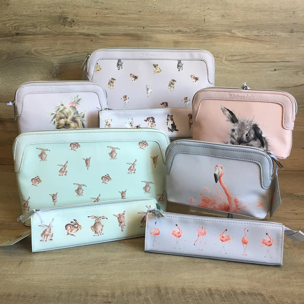 Photo of a selection of Wrendale designs pouches and make-up bags They are in shades of grey, mint and pink with different illustrations by Hannah Dale on them.