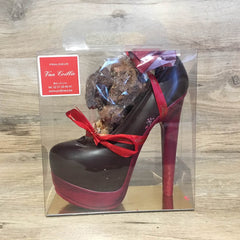 Photo of a chocolate heeled shoe filled with belgian chocolate truffles.