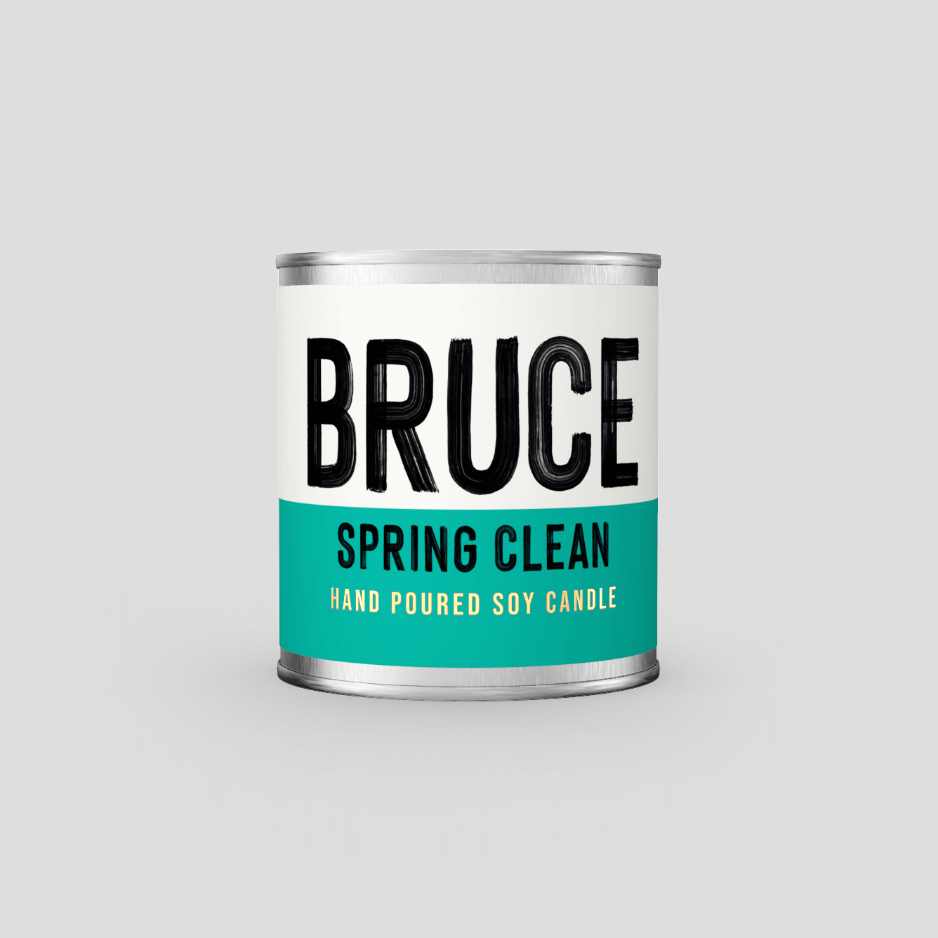 A hand poured soy wax candle in a paint can style aluminium can. The label says 'Bruce Spring Clean'