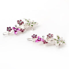 pair of swarovski hair barrettes with butterflies and flowers