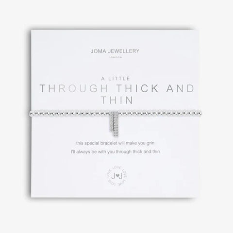 silver bracelet on card with silver foil that reads 'Through Thick and Thin'