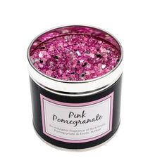 tin candle with pink glitter top and the scent pink pomegranate