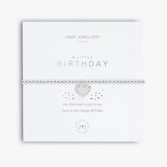 silver bracelet on white card with text that reads 'a little birthday'
