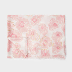 a folded scarf with a pink and white floral design