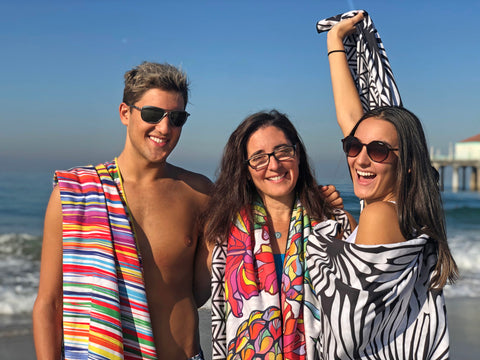 ECCOSOPHY team at the beach using ECCOSOPHY microfiber beach towels. The specific designs are Key West, Honolulu and Lovina.