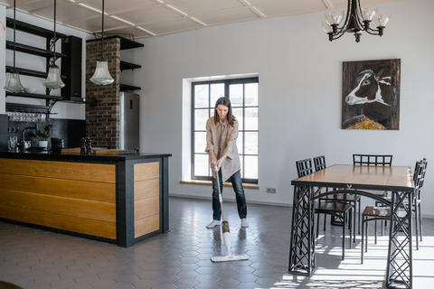 a person mops their floors