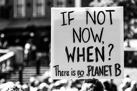 a black and white image of a sign that reads "if not now, when? there is no planet B"