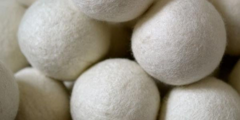 a close up of white dryer balls