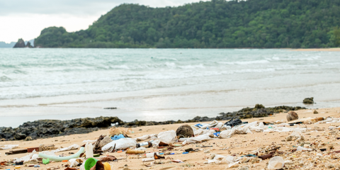 a beach covered in plastic pollution