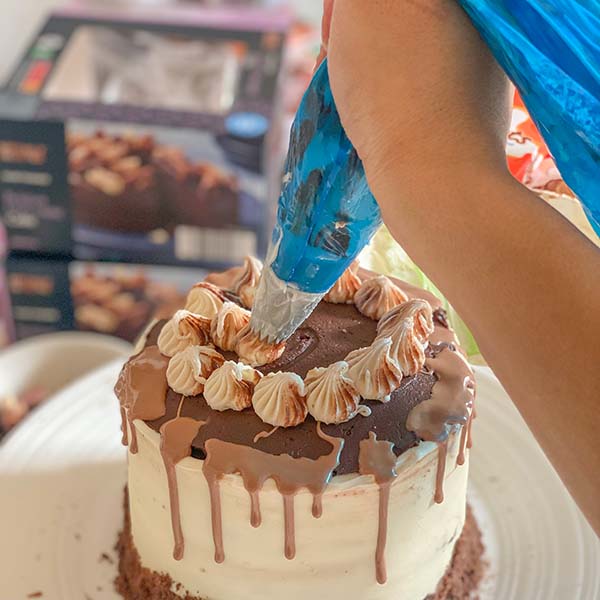 Fake Bake Aldi Kinder Cake Recipe - frosting swirls