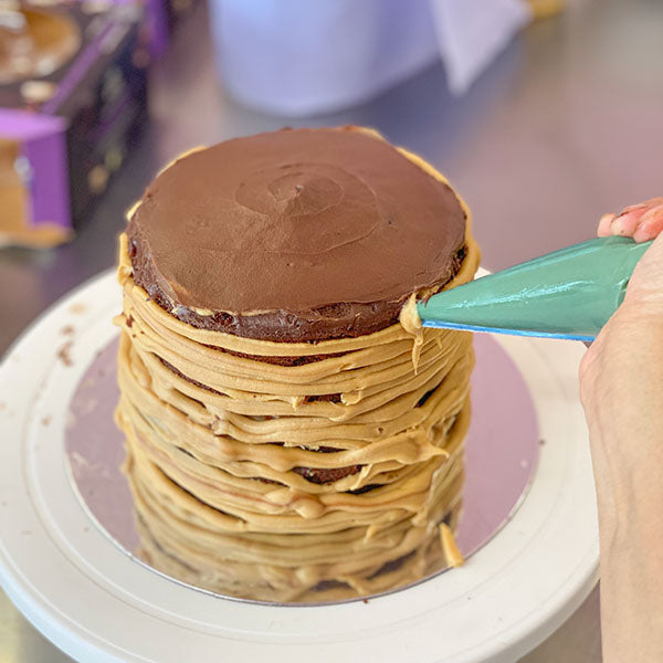 Fake Bake Chocolate Salted Caramel Cake Recipe - pipe frosting