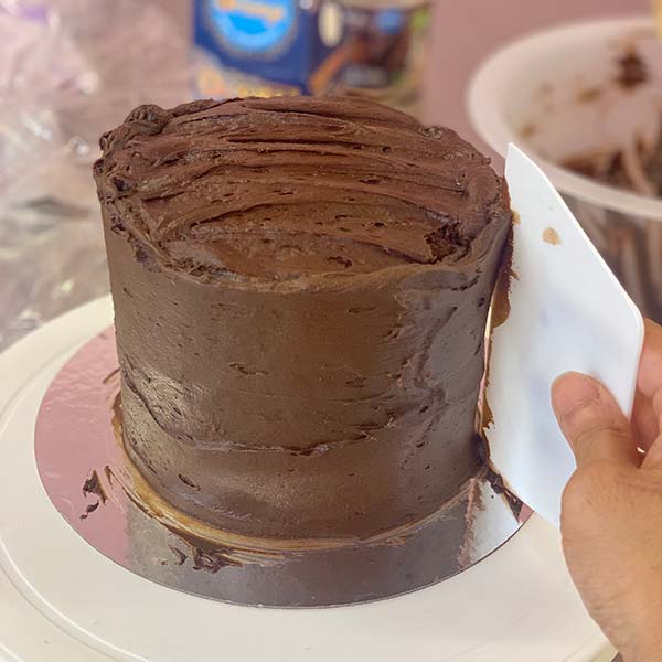 Fake Bakes Chocolate Orange Cake Recipe - smoothing frosting