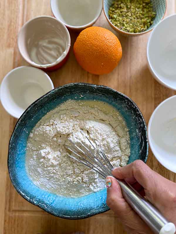 Orange and Pistachio Loaf Cake - hero sponge add flour and baking powder