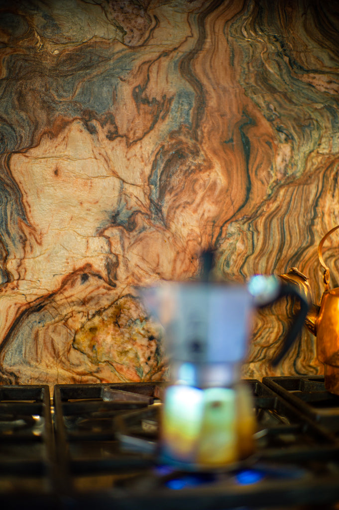 Bialetti coffee maker on stove with beautiful quartzite slab behind