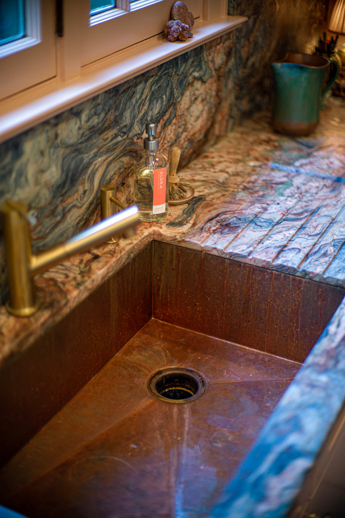 Kitchen sink with built-in countertop drainboard next to it