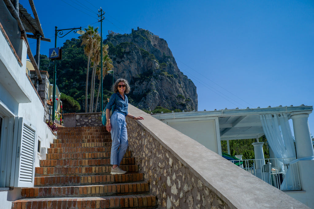 Woman standing on a beautiful staircase in Capri, Italy