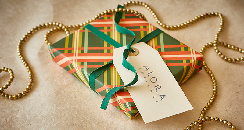 Present wrapped in green plaid wrapping paper