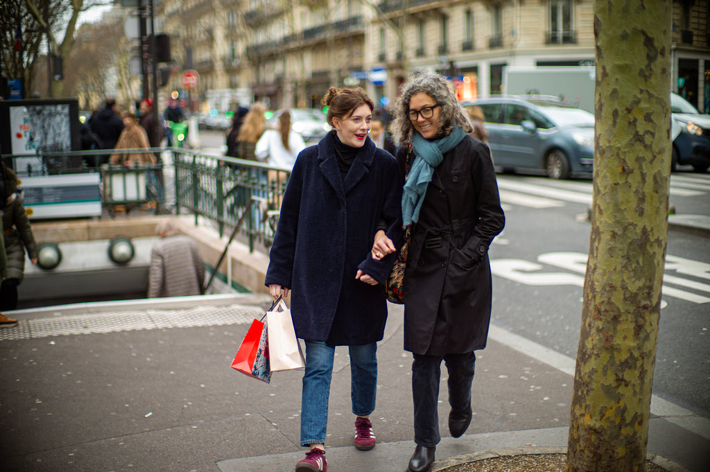 Two woman walking in Paris with red lipstick on