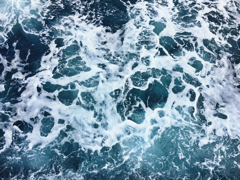 Deep blue ocean with foaming waves