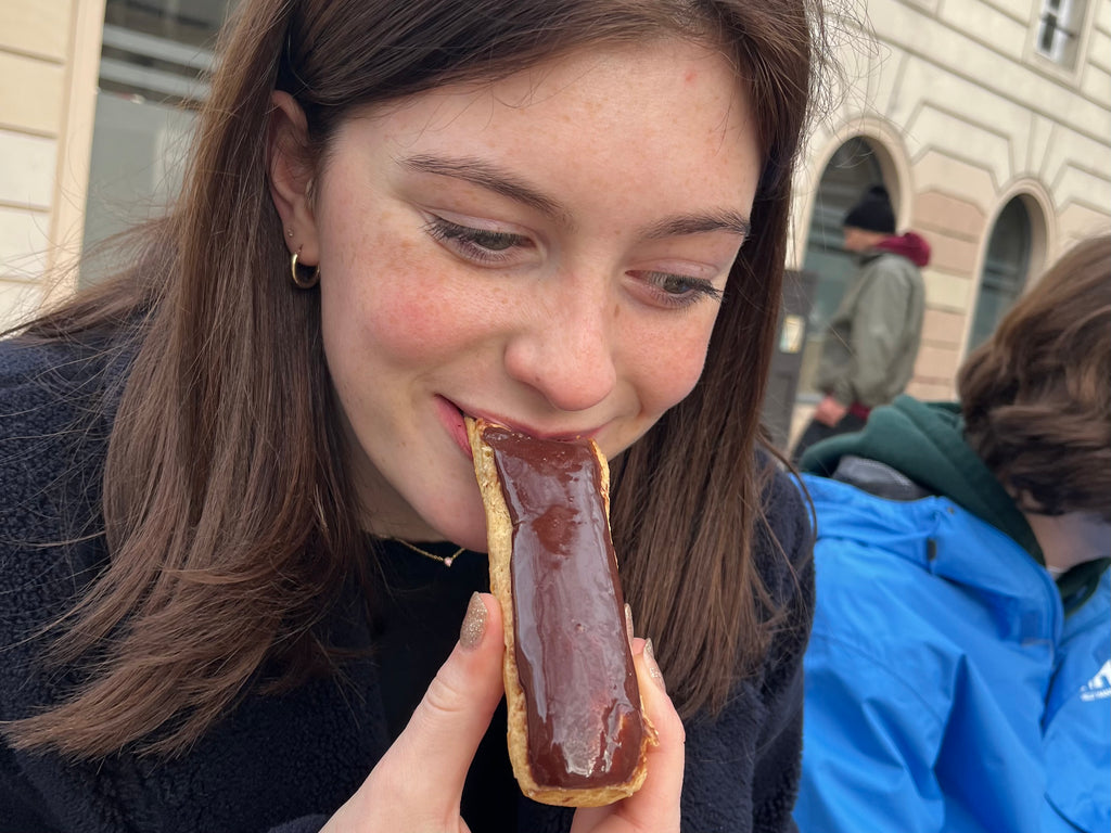 Girl eating an eclair